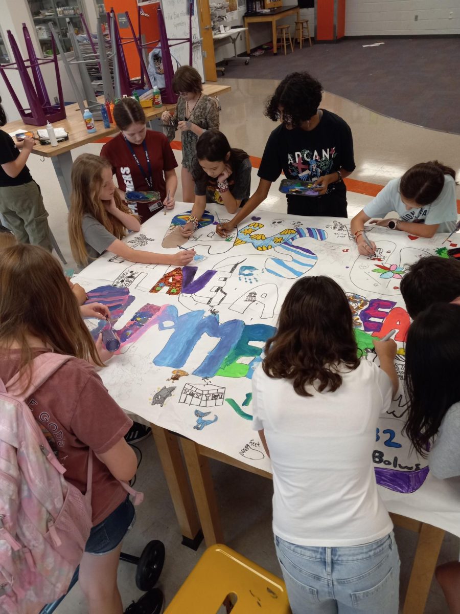 Students are busy working on their big final poster for Art Club. Zoey Hempel said, "I really like getting access to all of the different materials and hanging out with my friends that I made through art club."