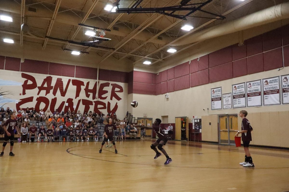 The JV team bumps it over the net again. Jamari Laster (7th) said, "I was excited about winning the game."
