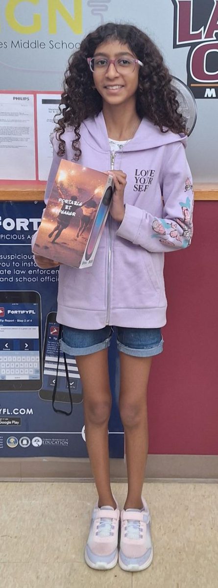 Nyssa Gaikwad (8) won a bluetooth speaker and was overjoyed to accept it. Nyssa says, "I was shocked that my name got called."