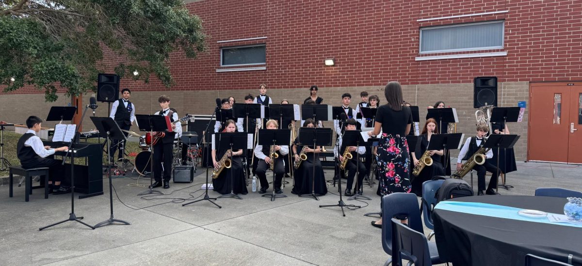 The LCMS Jazz band warms up in the Hagerty High School courtyard.
