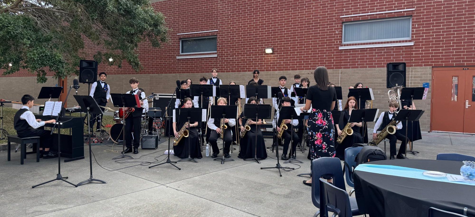 The LCMS Jazz band warms up in the Hagerty High School courtyard.