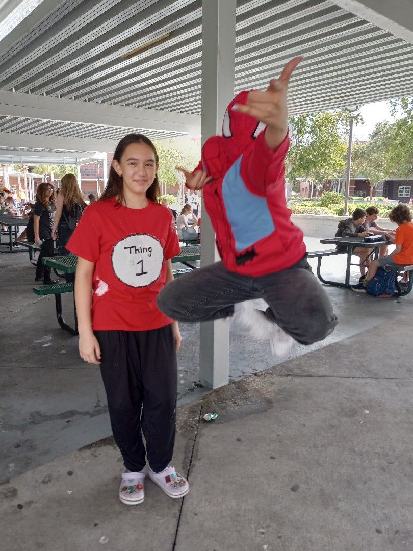 Thing 1 and Spiderman pose for a photo together.