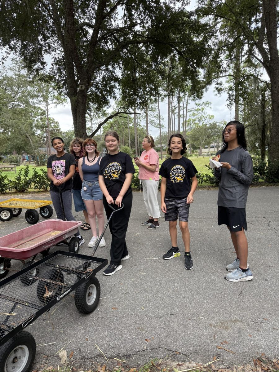 Beta Club is ready to help move pumpkins.