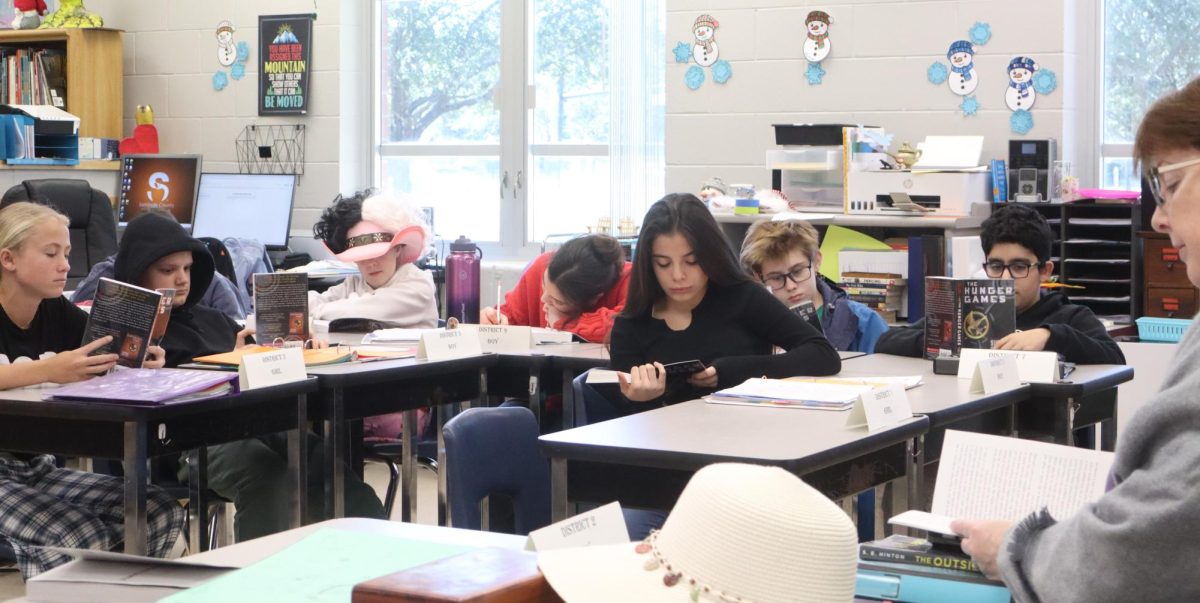 Let the Games Begin!
On 1/27/2026, Ms. Brady’s class got the official copies of 'The Hunger Games'. Her class was excited to start it, reading along while Ms. Brady read out loud.  Nevin Barclay said, “I am really excited to read the book because I love the Hunger Games. I’ve read it before and I feel like in class it's more interactive then reading it on your own. Overall I'm really excited to read it in class.” 
