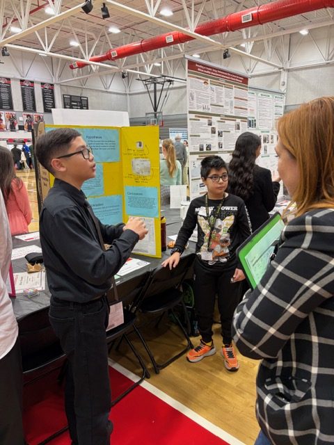 Ethan and Samirbek show off there project and they win Honorable Mention