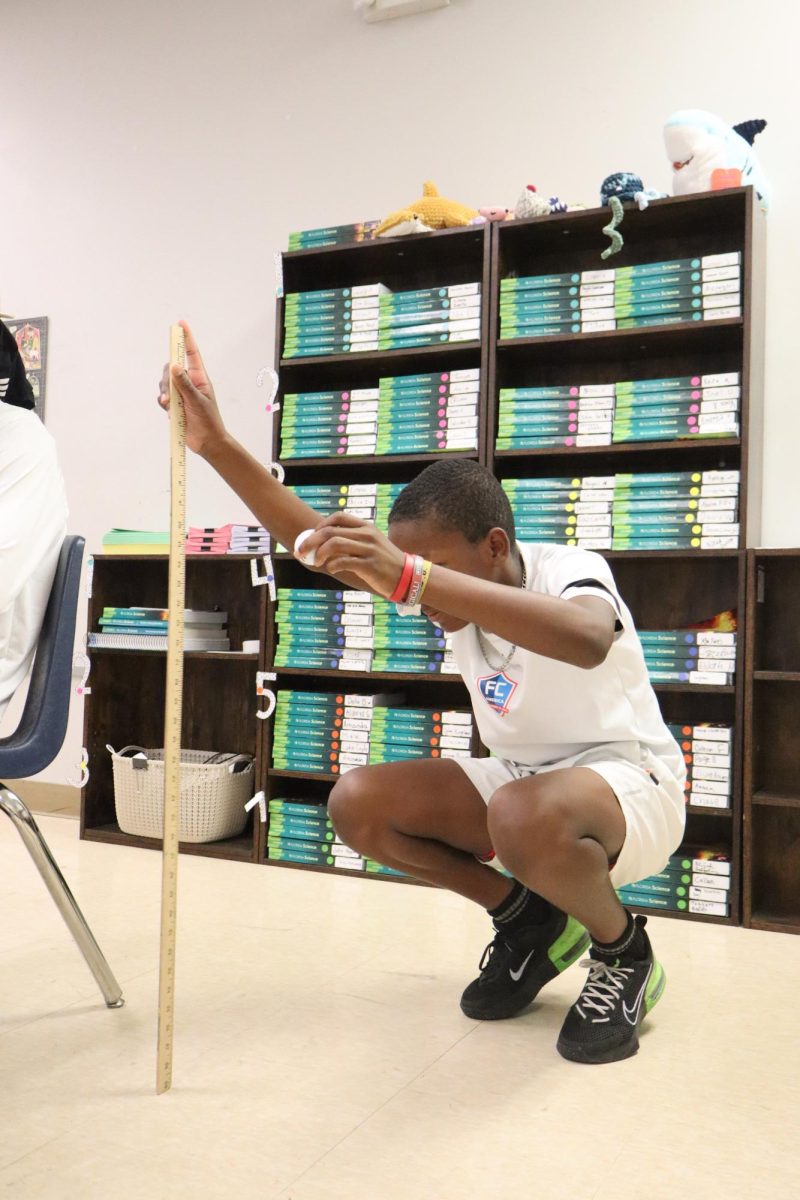 Kendall Geter performs the bounce lab project for Mrs. Heckle's 8th grade science class. Kendall states "I liked this lab because science is fun."
