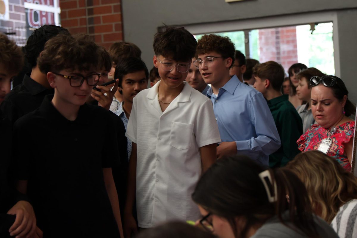 8th graders check in for the dance.