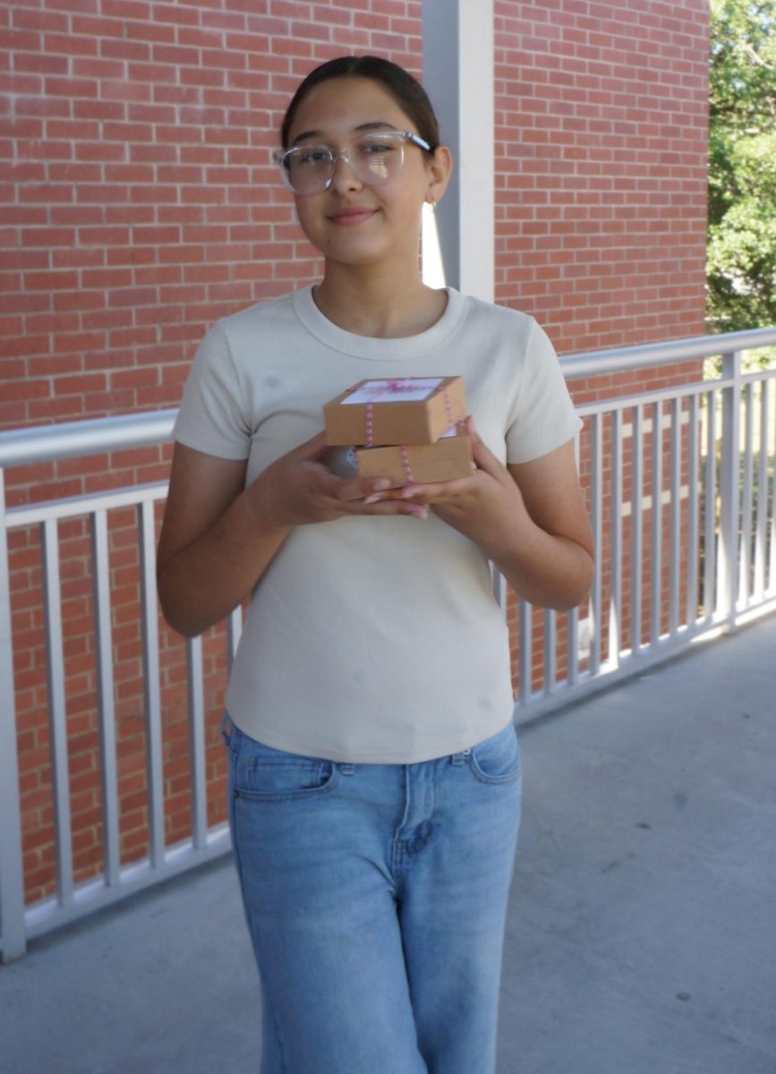 Elise Holds her cookies she made as a gift for her teachers. Later in the day she will distribute them to the teachers.