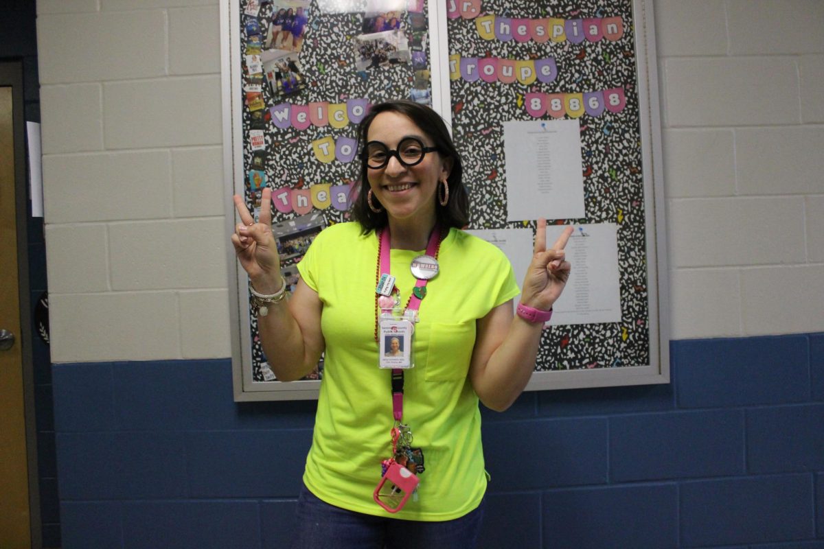 Mrs T dresses in yellow for spirit day.