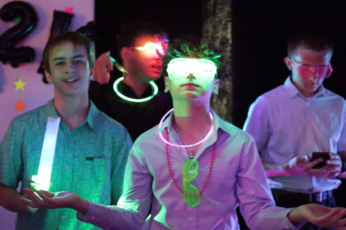 Jax Nevarez flexes his new light-up glasses at the 8th grade dance.