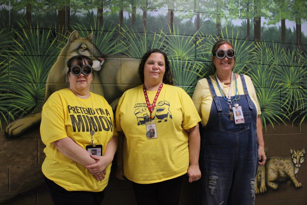 The front office admin dress up in honor of Mr Minion.