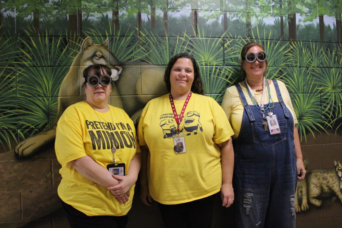 The front office admin dress up in honor of Mr Minion.