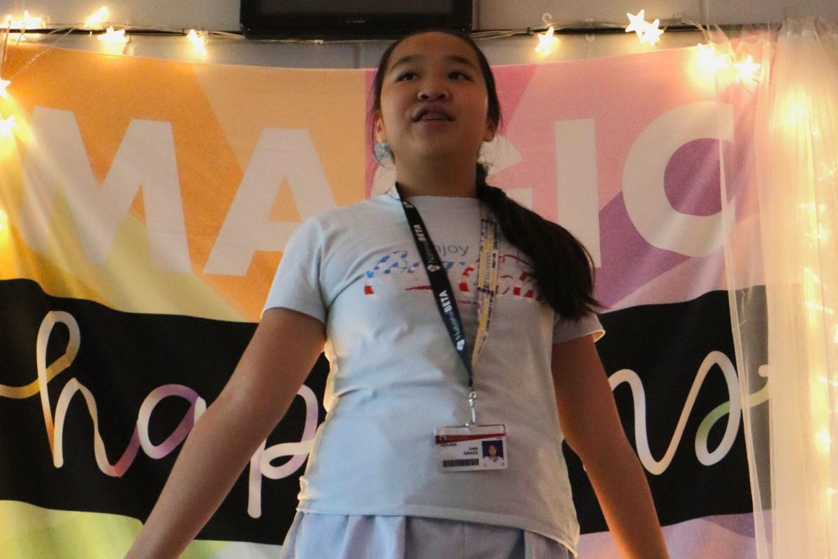 Grace Han recites her speech on Mrs. T's stage.