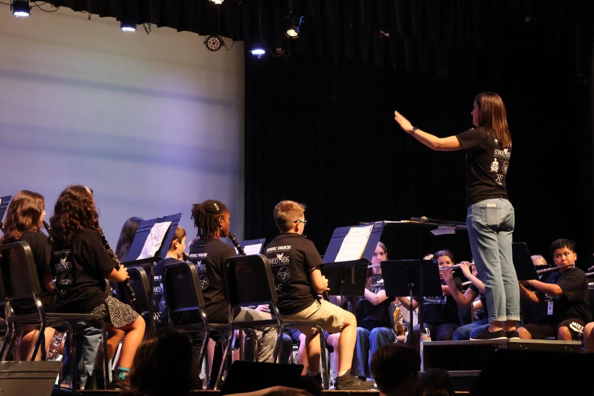 Mrs. Kuperman directs the beginning band students to play the pieces they’ve practiced.